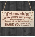 WOODEN PLAQUE - 200x100 - Friendship is like pissing in your pants